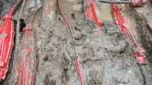 cable joints covered in mud in wet trench